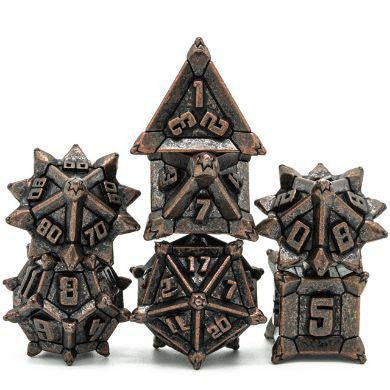 Ancient Copper Flail RPG Metal Dice Set with seven spiked, engraved metal polyhedral dice.