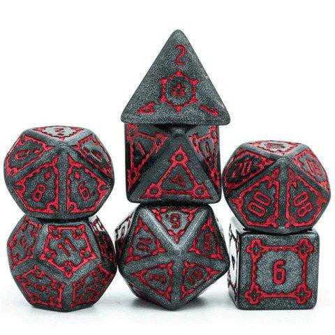 The Huge Black Castle Dice Set - 25mm with five black polyhedral dice featuring red numbers.