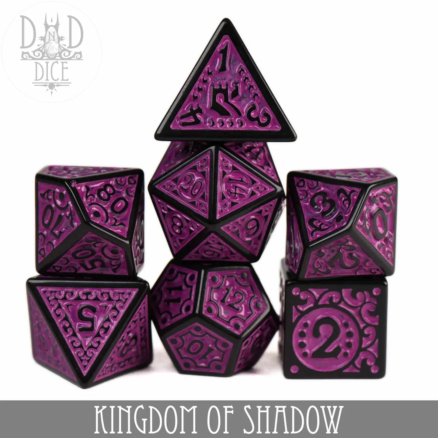 Kingdom of Shadow Dice Set: 7 purple and black metal polyhedral dice with intricate patterns.