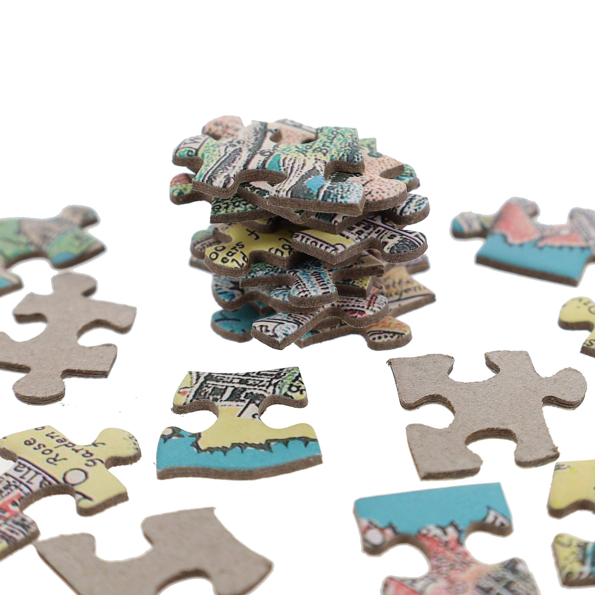 Stack of America the Wonderland 1,000-piece jigsaw puzzles with map print on a white background.