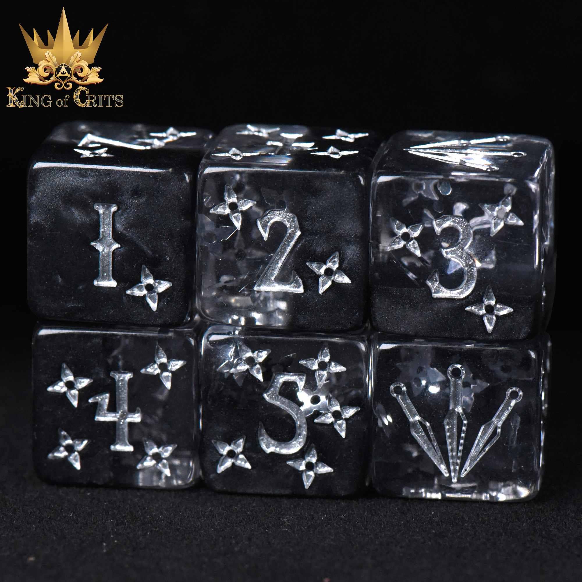 Art of Stealth - 11 Dice Set: clear resin dice with silver numbers and custom symbols.