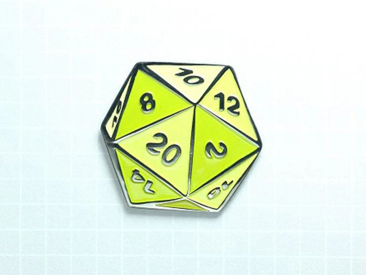 D20 Dice Ochre Yellow Enamel Pin with green facets and black numbers on a grid-patterned background.