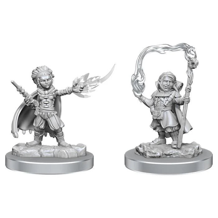 Halfling Wizards D&D: Nolzurs Marvelous Miniatures, one casting fire, one holding staff with swirling magic above.