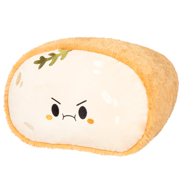 Loaf-shaped Sourdough Comfort Food Squishable Plushie with angry cartoon face and leaf detail on top.