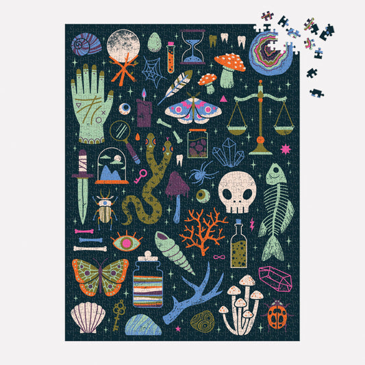 Occult and Curious 1000 Piece Glow Puzzle featuring mystical objects, animals, plants; four pieces are missing.
