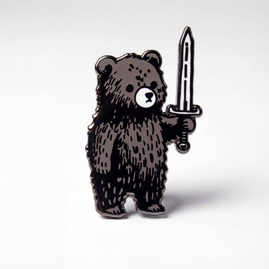 Murder Bear pin, black-plated, depicting a bear holding a sword, with a deluxe clasp.