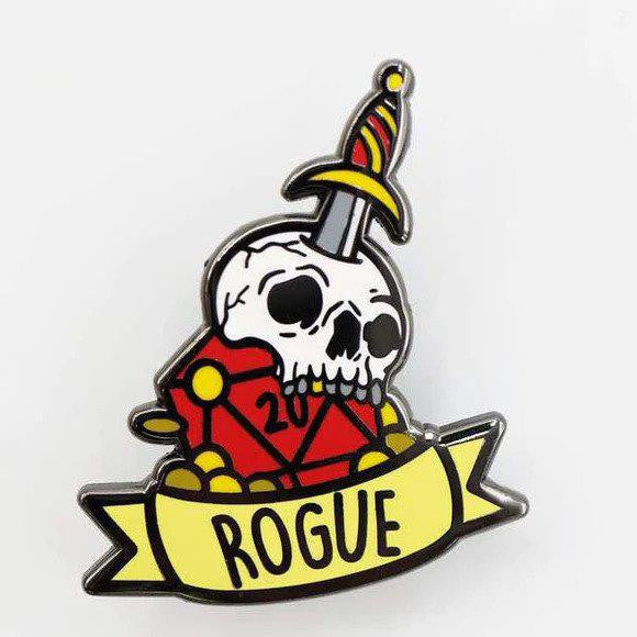 Rogue Banner Class Pin featuring a skull and dagger on a red d20 with a yellow ROGUE banner.