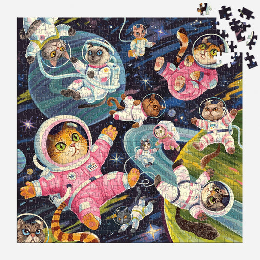 A Space Meowdyssey 500 Piece Puzzle with cats in space suits; several corner pieces missing.