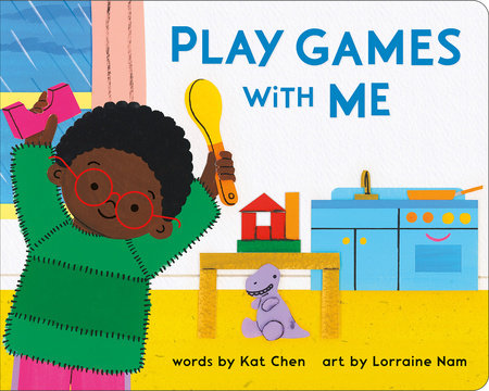 Child with glasses holds toy and spoon from Play Games With Me set in kitchen.