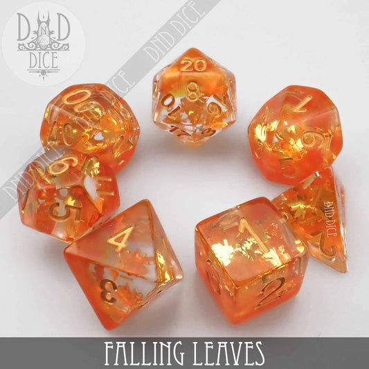 Set of seven orange and gold translucent resin dice, Falling Leaves variant, for tabletop gaming.