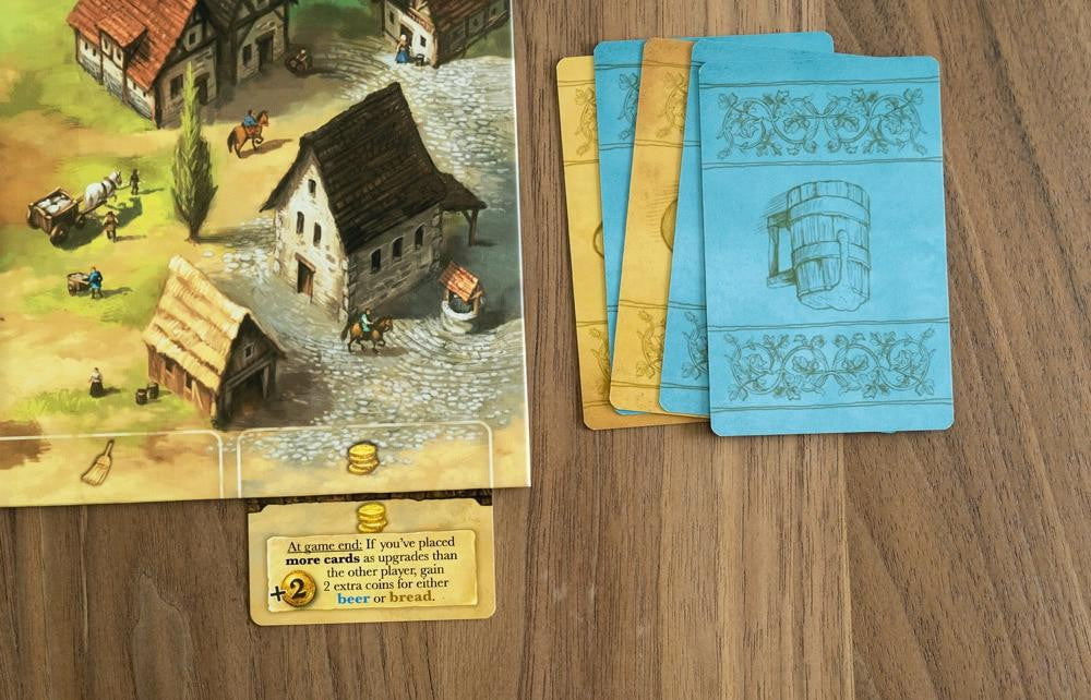 Beer & Bread two-player card game with illustrated cards on a wooden table.