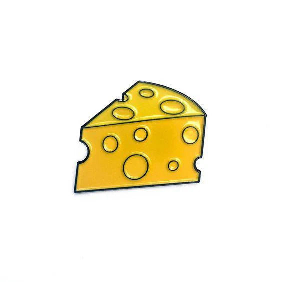Cartoon-style yellow Swiss cheese enamel pin with holes on a white background.