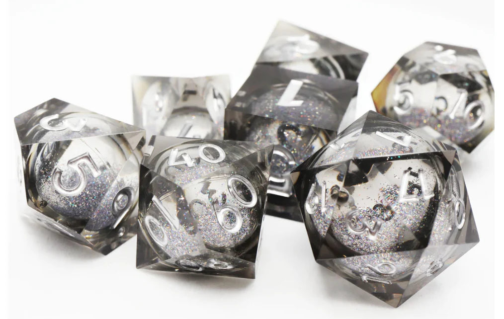 Black Liquid Core Sharp Edge Resin RPG Dice Set with clear sides and silver numbers.