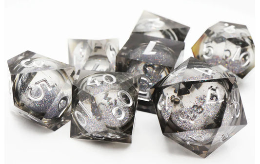 Black Liquid Core Sharp Edge Resin RPG Dice Set with clear sides and silver numbers.