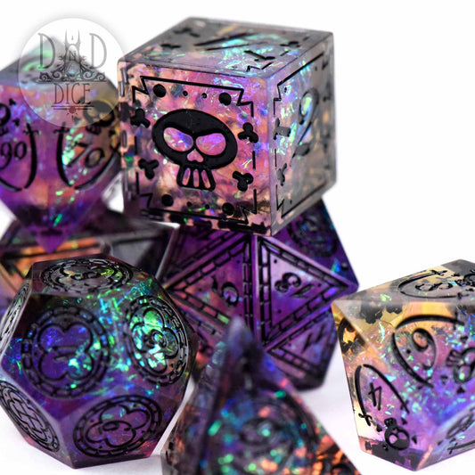Black Beards Blight handmade iridescent resin dice with black heart, skull, and shield designs.