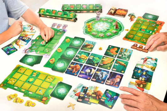 Living Forest board game with cards and tokens in play on a white table with two players.