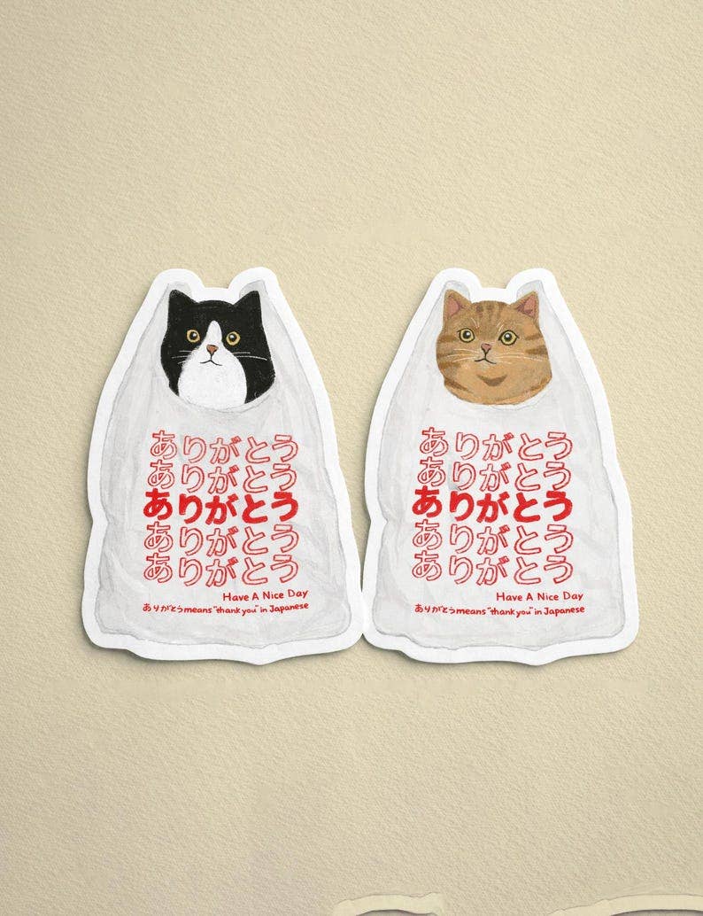 Sticker featuring ginger cat illustration with “Arigatou” in Japanese and “Thank You” in English.