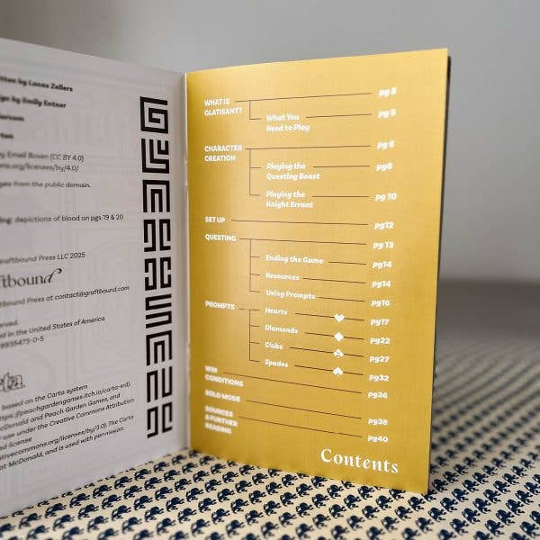 Open Glatisant solo journaling game booklet showing a table of contents with chapter titles and page numbers.