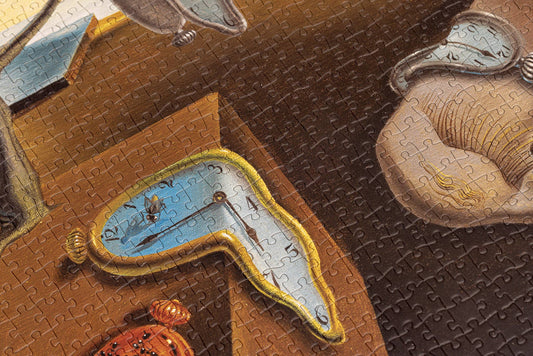 Puzzle featuring Salvador Dalis Persistence of Memory with surreal melting clocks.