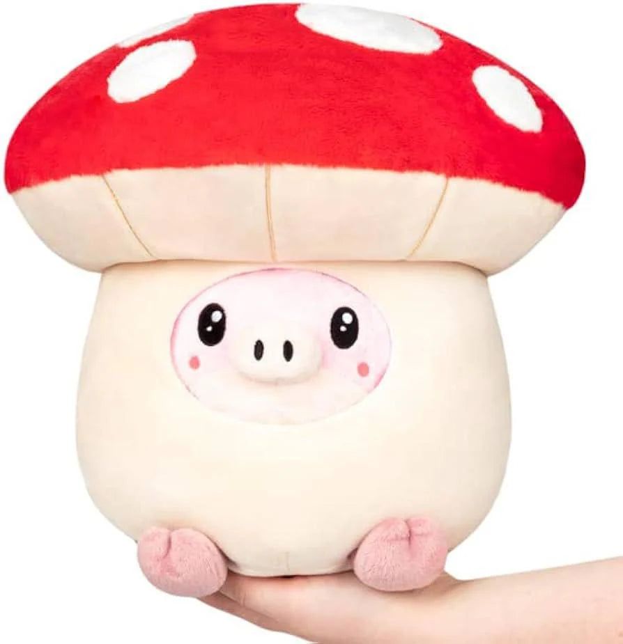 Undercover Pig in Mushroom Squishable plush, showing a pig partially inside a red-capped mushroom, held in a hand.