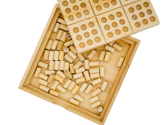 Ecologicals Bamboo Sudoku set in a wooden box with perforated lid and small bamboo cylinders inside.