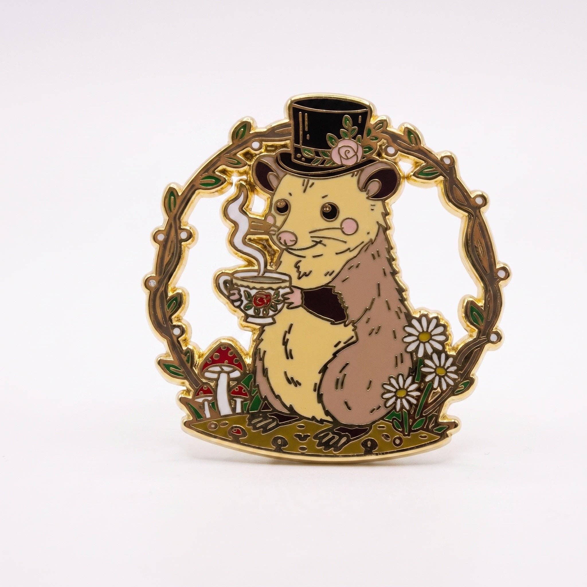 Mr. Fancy Possum hard enamel pin, featuring a possum in a top hat holding a teacup, framed by gold-plated floral branches.