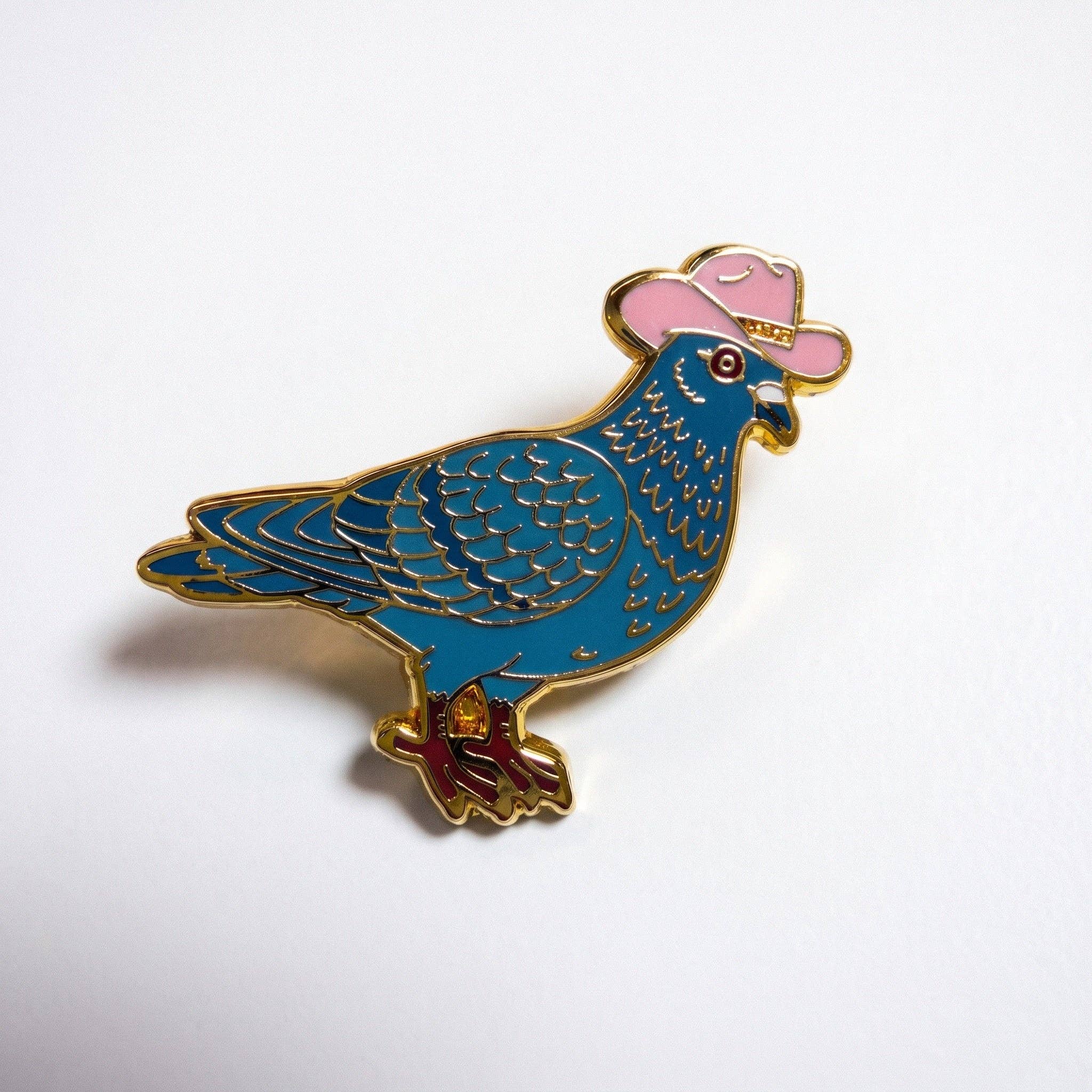 Gold-plated hard enamel pigeon pin wearing a pink cowboy hat with gold trim.