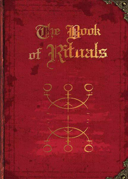 Worn red Book of Rituals featuring gold lettering and a golden symbol below the title.