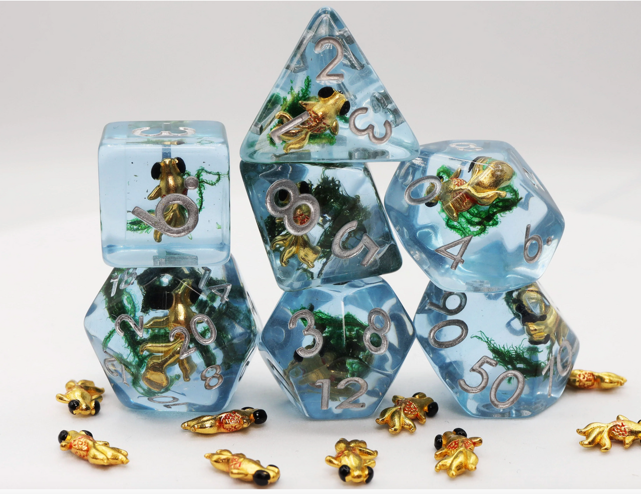 Goldfish RPG Dice Set featuring blue resin polyhedral dice with goldfish figures and matching charms inside.