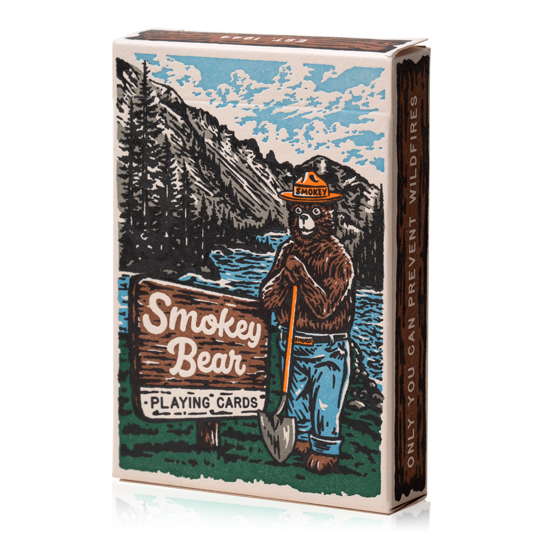 Smokey Bear playing cards with forest imagery and the text, Only you can prevent wildfires.