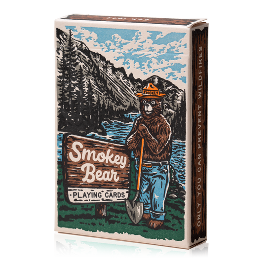 Smokey Bear playing cards with forest imagery and the text, Only you can prevent wildfires.