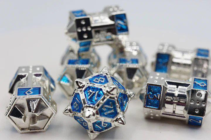 The Dice 51: Interstellar Indigo CCG Metal Dice Set on a white surface.