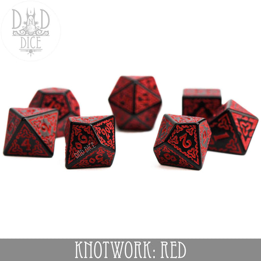 Set of seven red and black acrylic Knotwork dice with knotwork designs and a teardrop-shaped D4.
