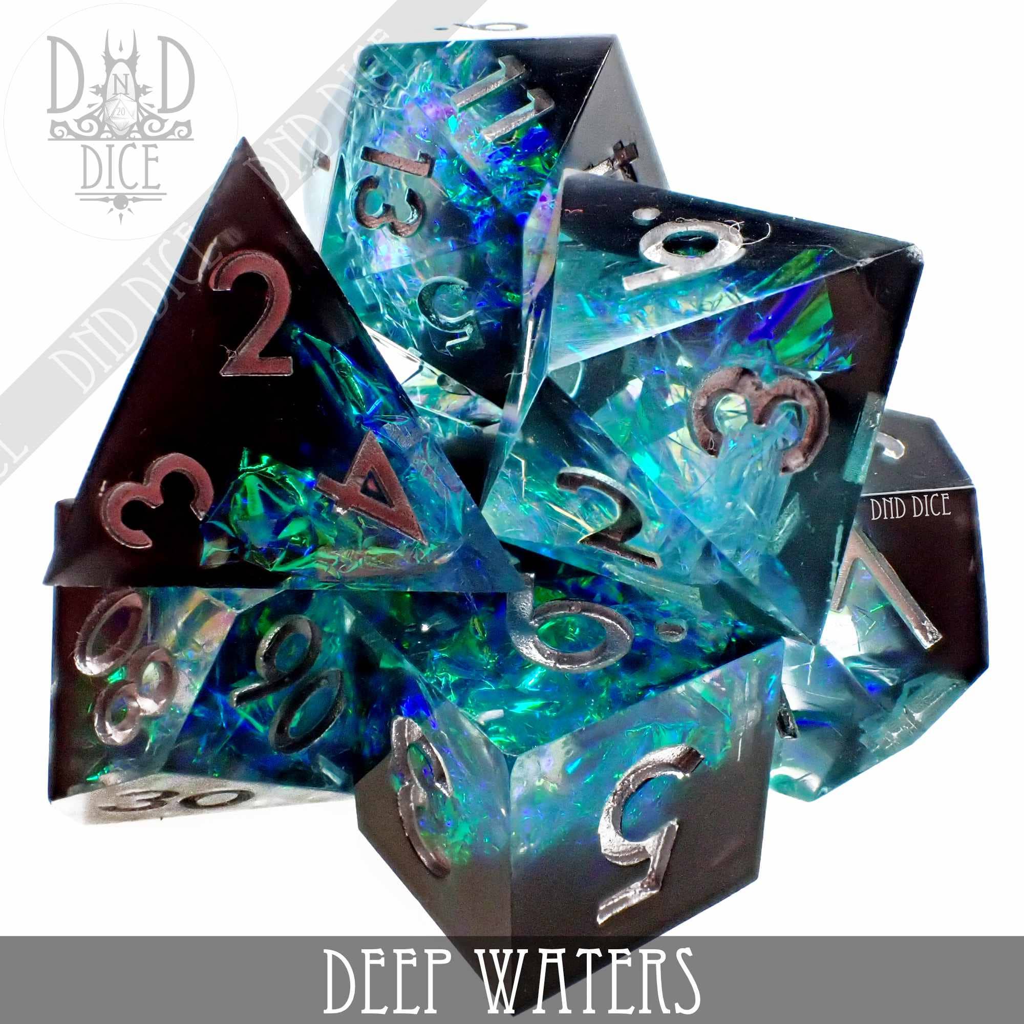 Deep Waters Handmade: 7-piece translucent dice set, blue and green iridescent foil, silver numbers.