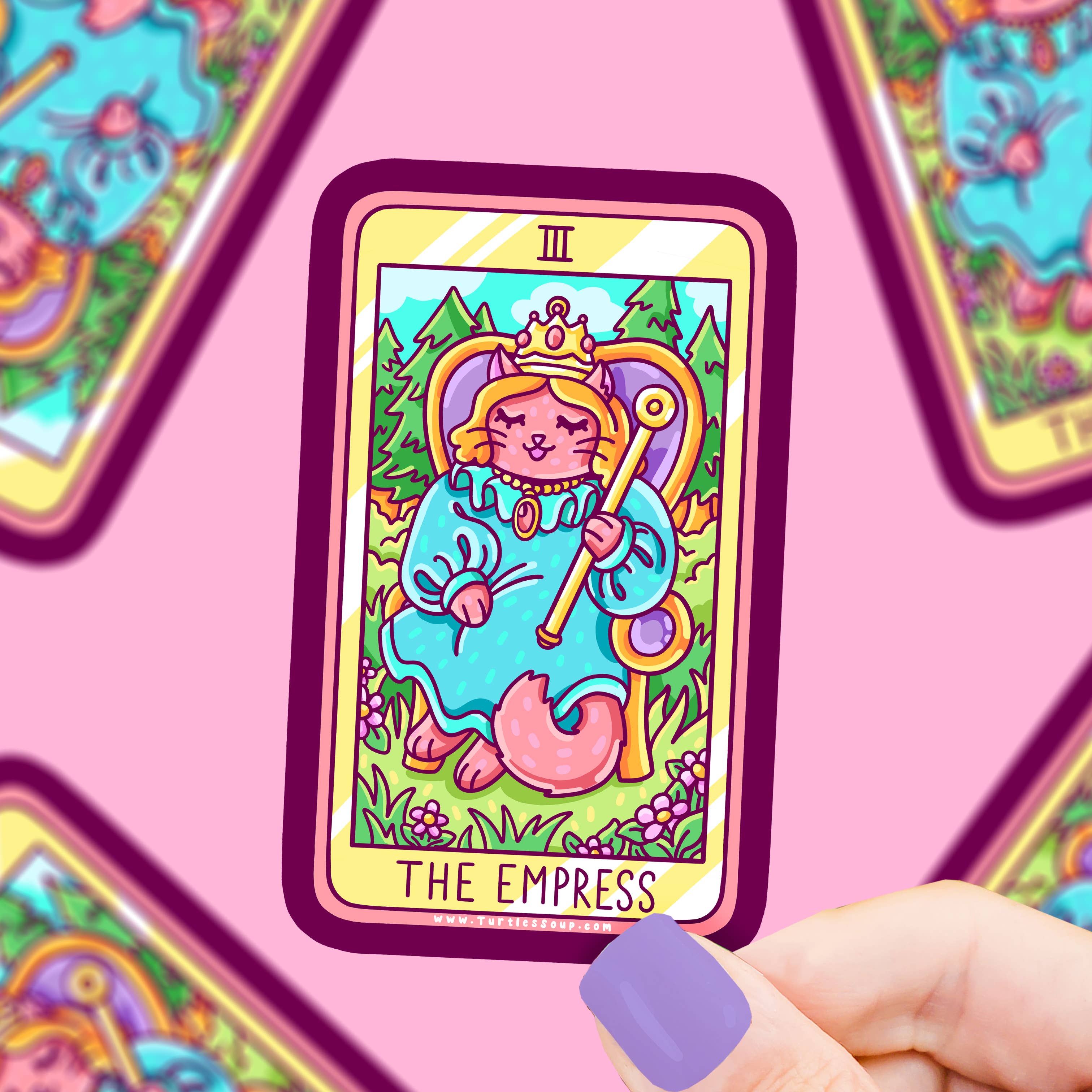 The Empress Kitty Cat Major Arcana Tarot Card Vinyl Sticker held by a hand with purple nails.