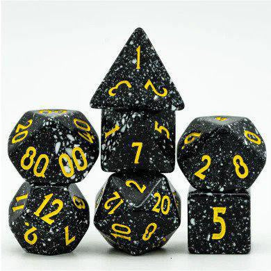 Deep Space RPG Dice Set, speckled black with yellow numbers. Set displayed on a white background.