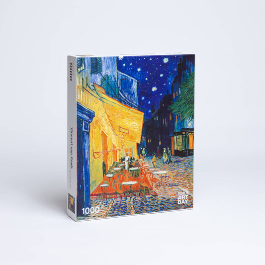 Vincent van Gogh Cafe Terrace puzzle, 1000 pieces, features vivid blues, yellows, and a starry night sky.