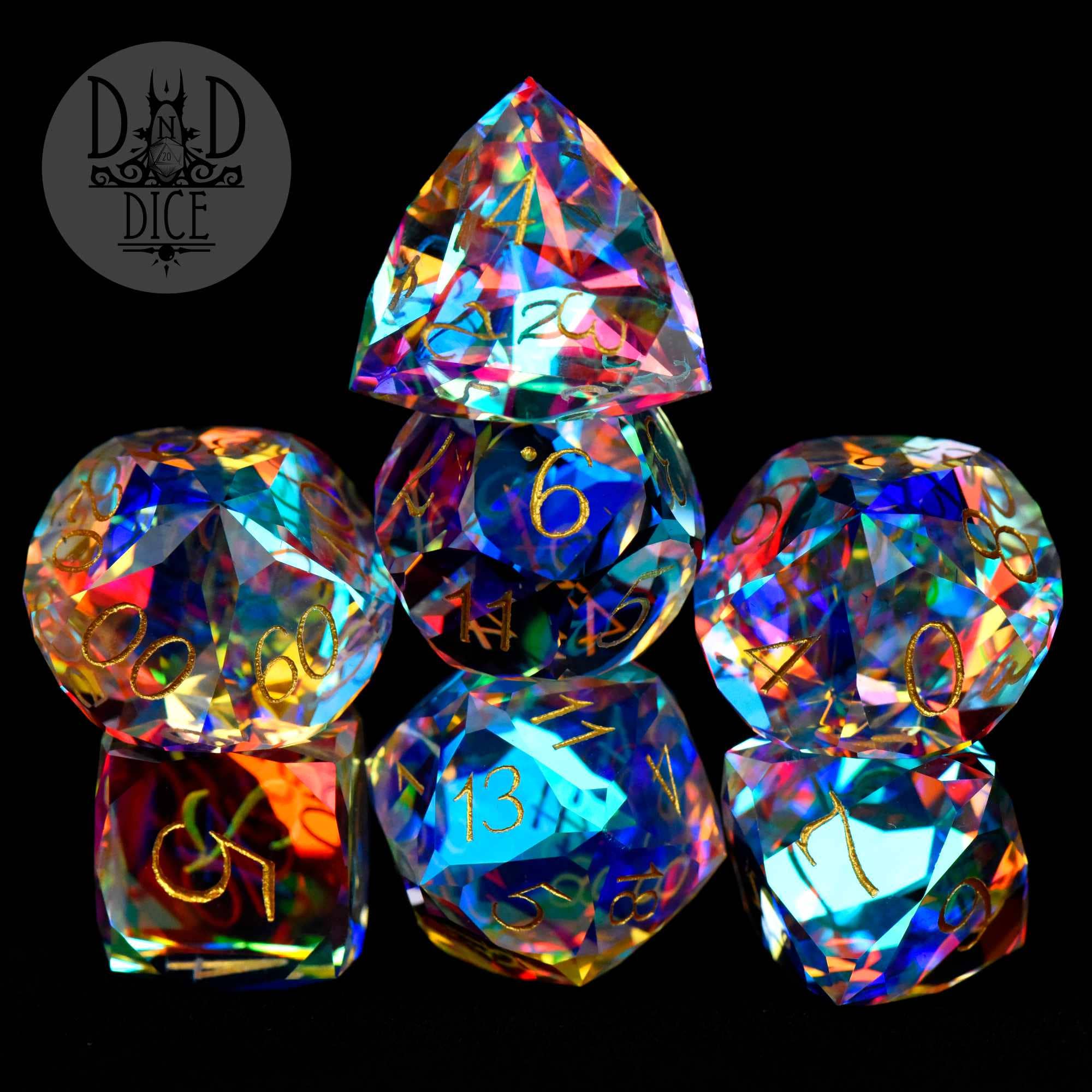 Gem Cut Prism Gift Box: set of 7 faceted dice, black with gold numbers, DnD Dice logo in the corner.