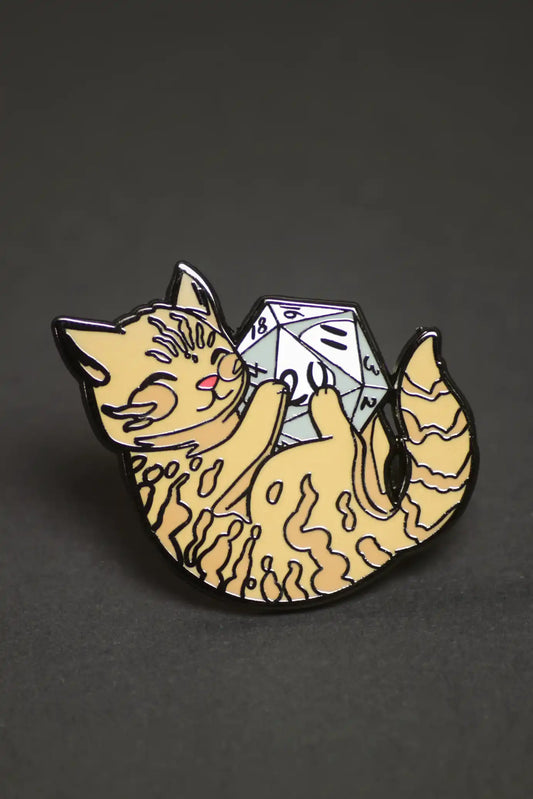 Pin pack featuring an orange tabby cat with a 20-sided die.