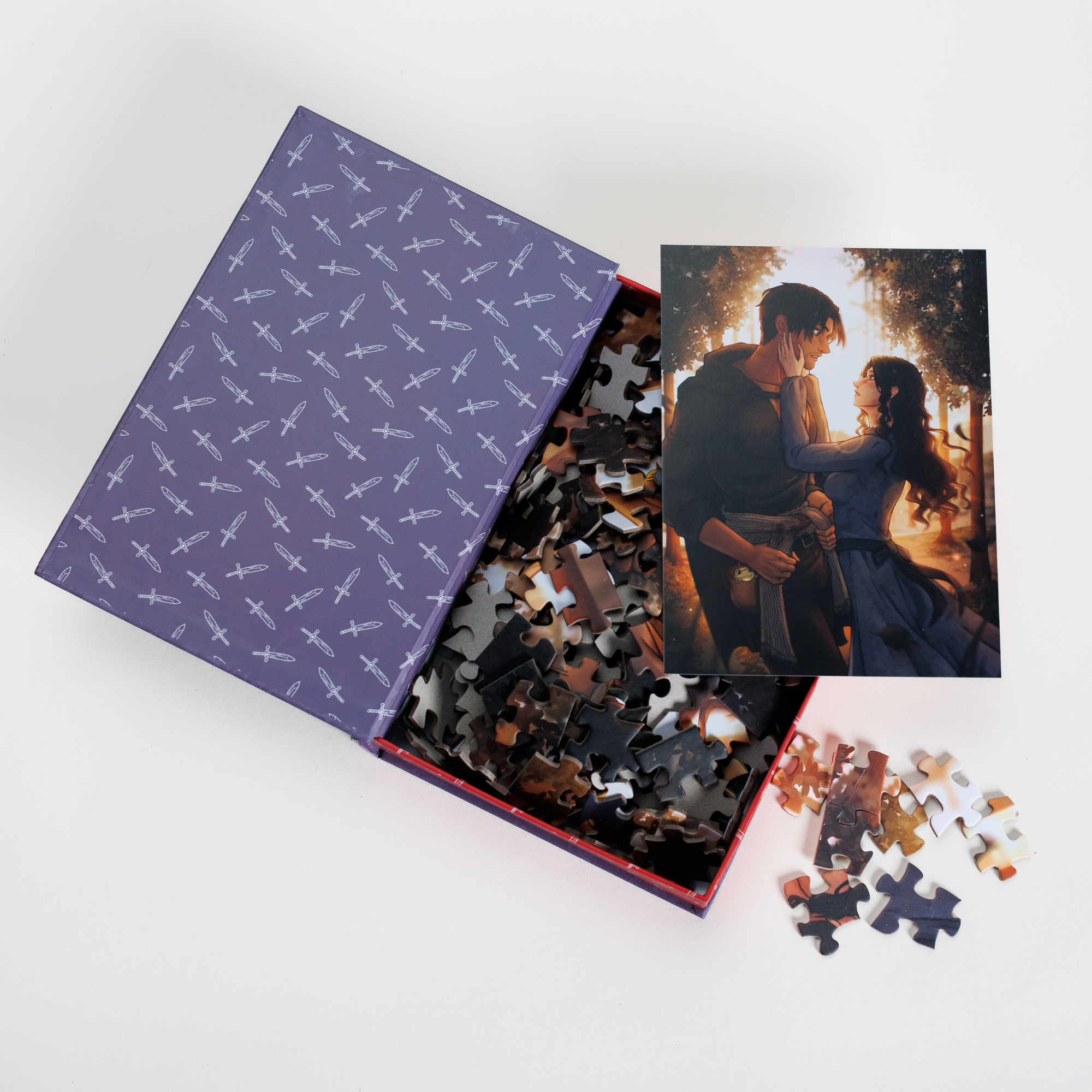 Evie & Villain Keepsake Puzzle in a book-shaped box, featuring romantic fantasy art.