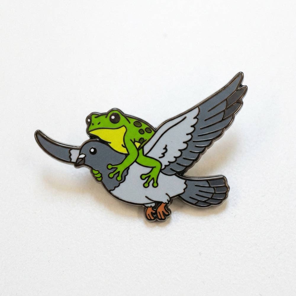 1.25-inch pin of a green frog riding a flying pigeon.