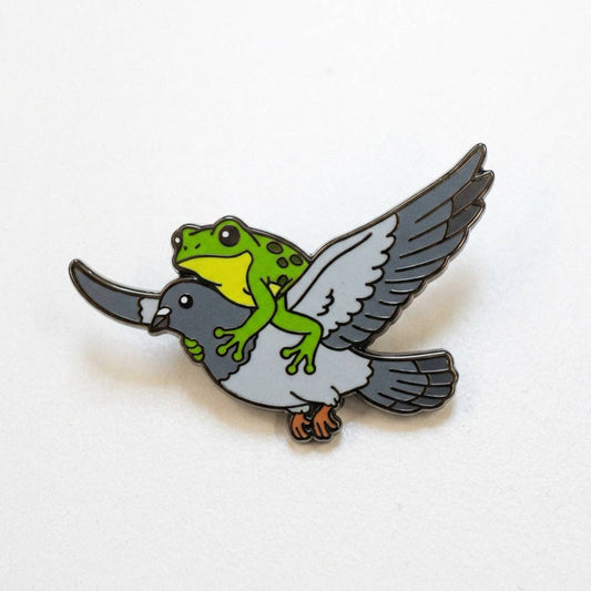 1.25-inch pin of a green frog riding a flying pigeon.