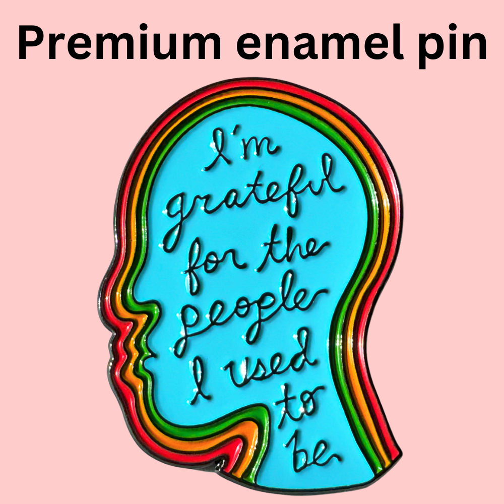 The People I Used To Be enamel pin, 1.5 head shape, pink background, text: Im grateful for the people I used to be.