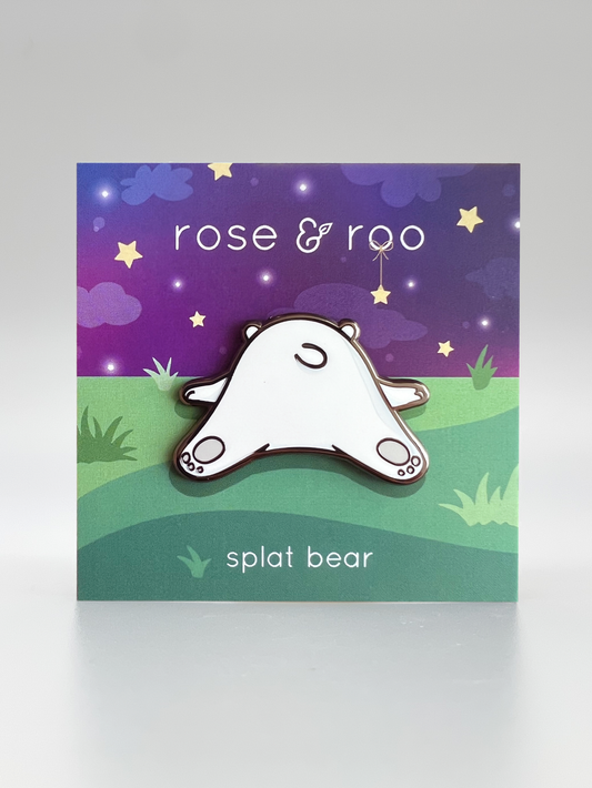 Splat Bear enamel pin displayed on a card labeled splat bear.