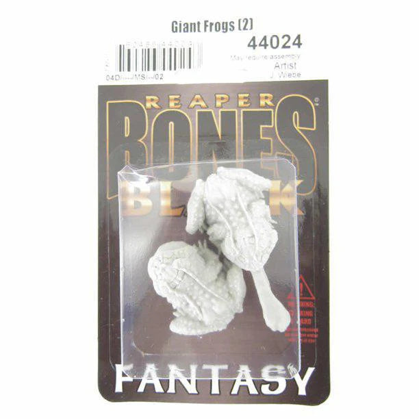 Two unpainted Reaper Bones Black Giant Frogs miniatures in clear plastic packaging.