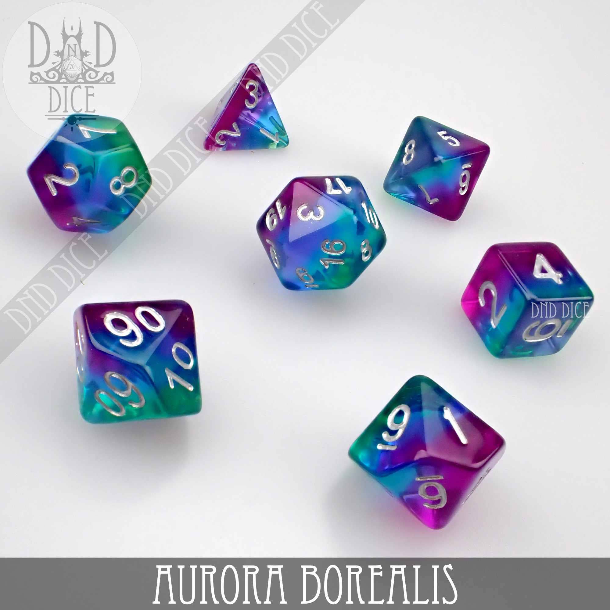 Aurora Borealis 7-piece polyhedral resin dice set in teal, purple, and blue.
