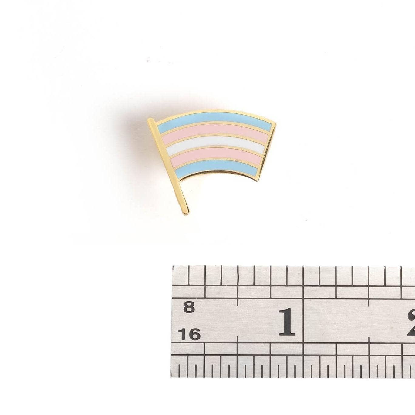 Trans Pride Flag Pin next to a ruler, approximately 1 inch wide.