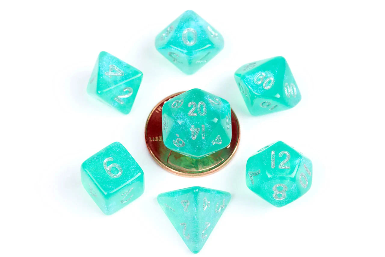 Six Stardust Turquoise 10mm mini polyhedral dice with a penny for scale on a white background.