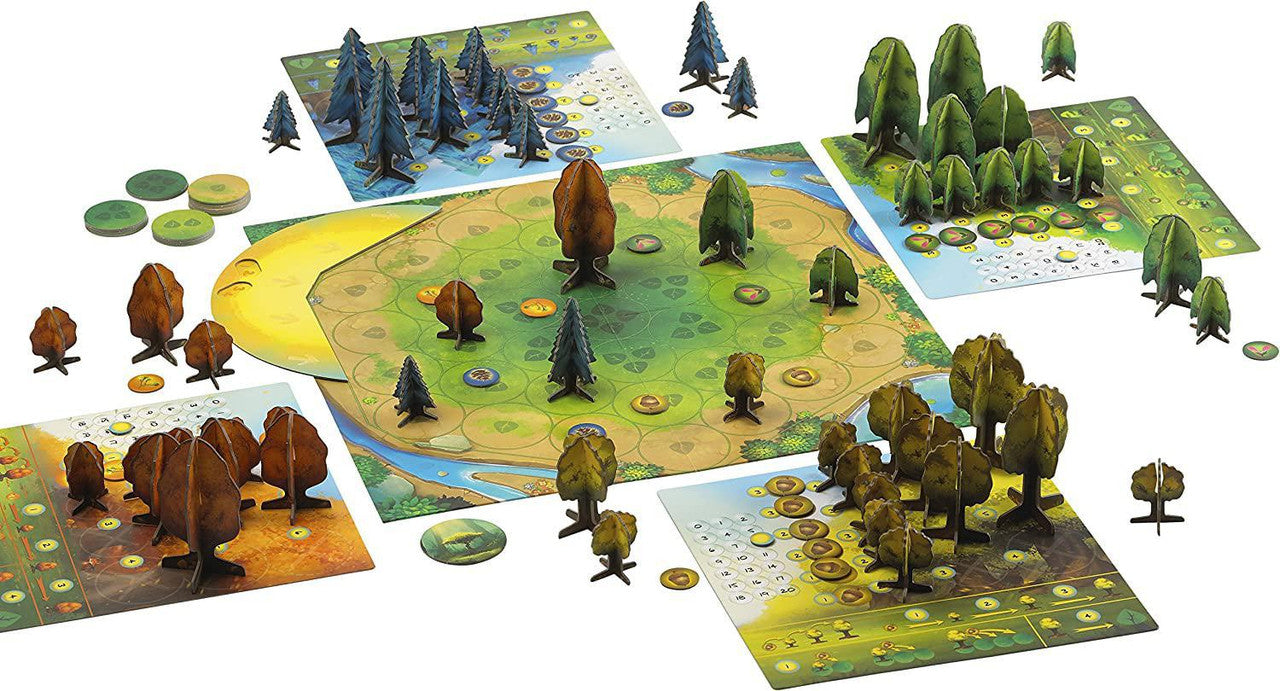 Photosynthesis board game with 3D tree pieces, round tokens, and four player boards around a central colorful board.