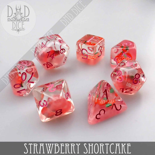 Strawberry Shortcake 7-piece pink resin dice set with strawberry and cream design for tabletop gaming.
